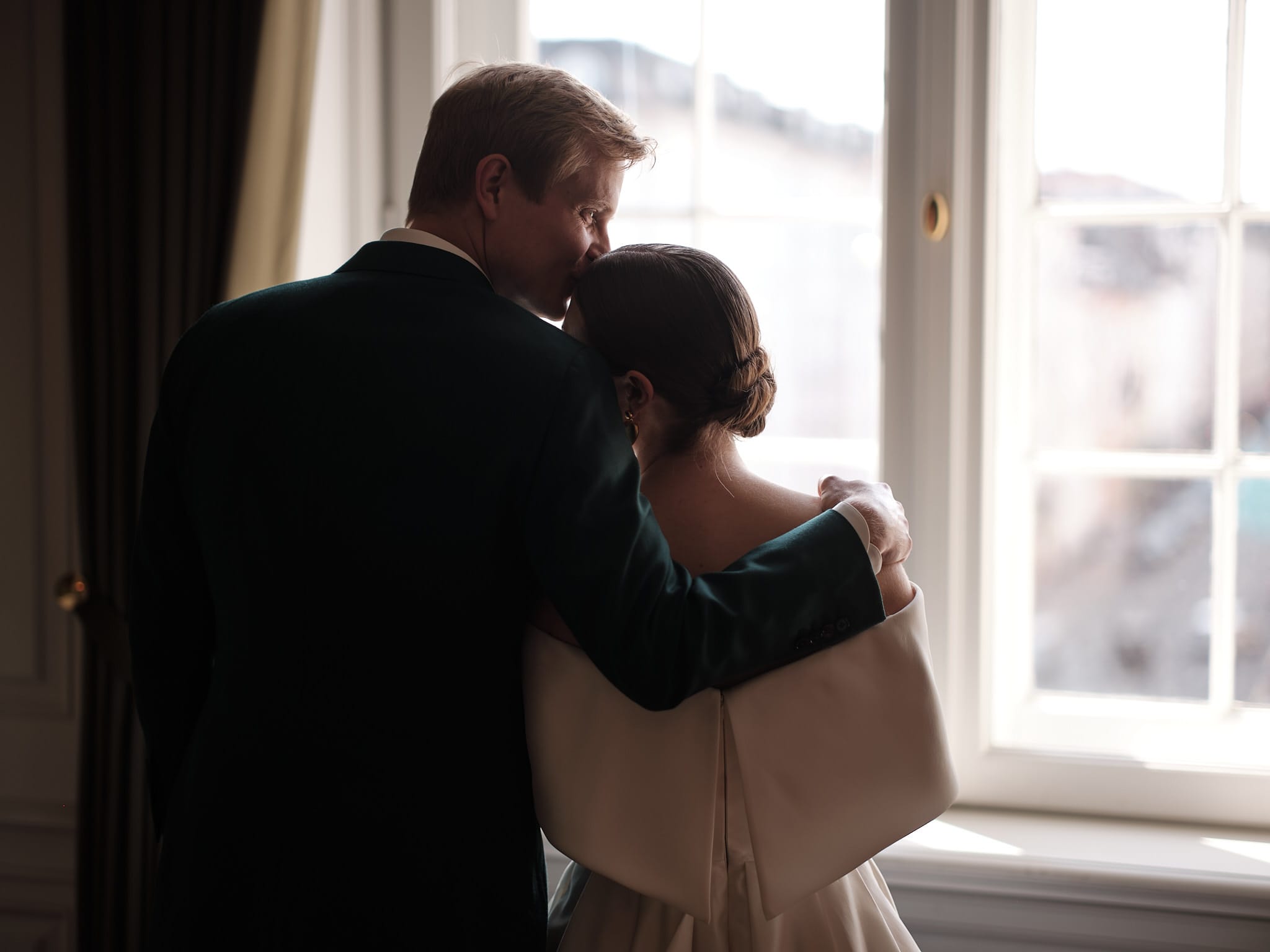 Wedding couple photographed in soft window light