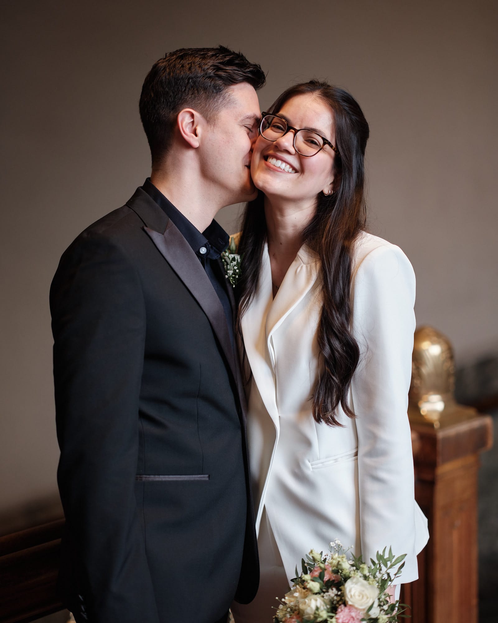 Newly married couple sharing a quiet moment inside Copenhagen City Hall
