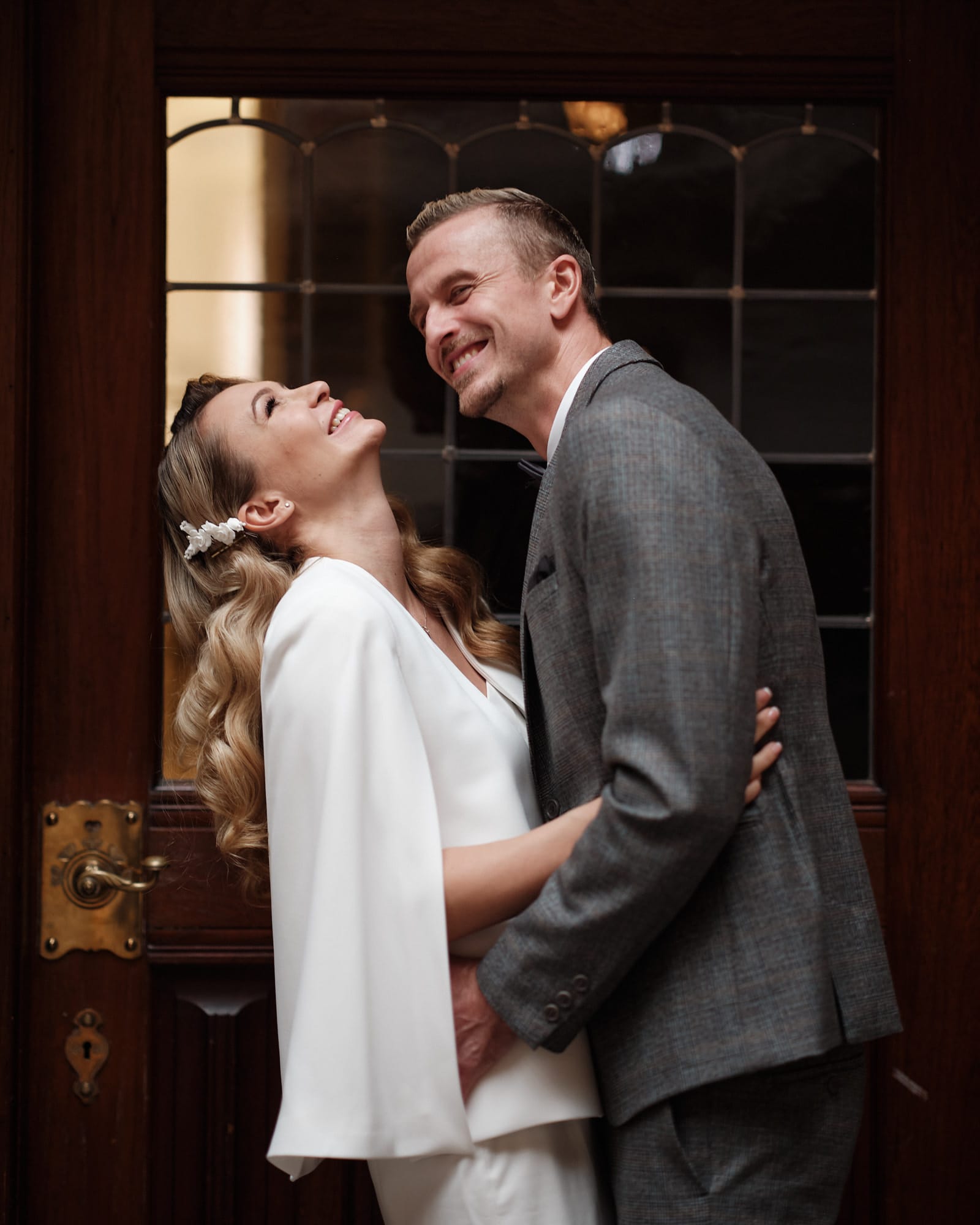 Happy couple laughing together in historic Copenhagen surroundings