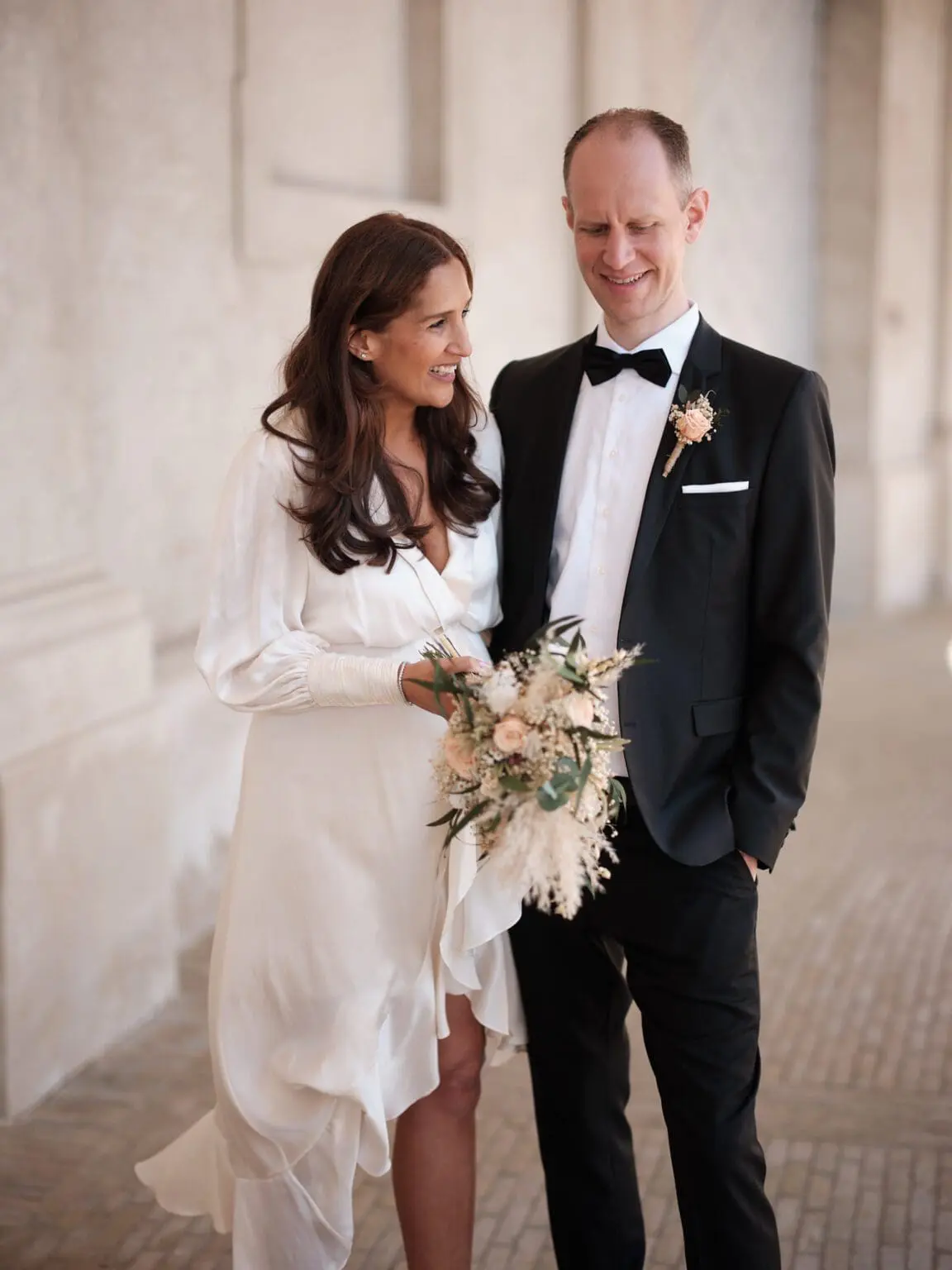 Bride and groom share a smile at the Riding Ground Complex, Christiansborg Palace